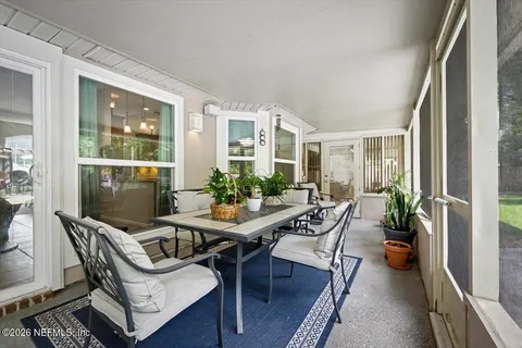 a view of a patio with chairs and a yard