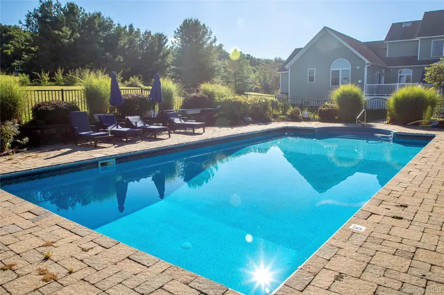 a view of a swimming pool with a patio
