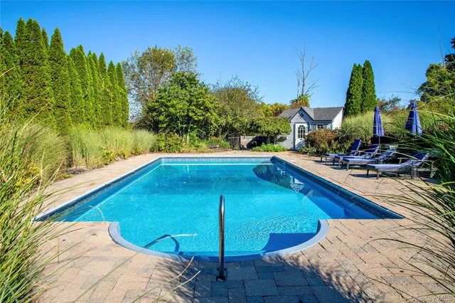 a view of a swimming pool with a patio