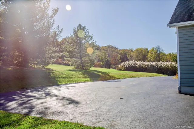 a view of a garden with sitting area