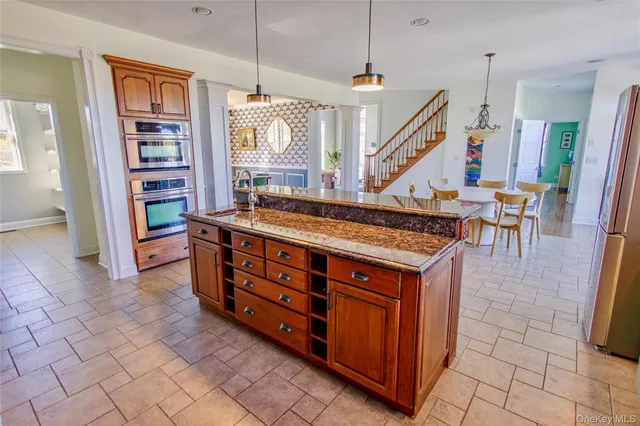 a room with lots of wooden furniture and a rug