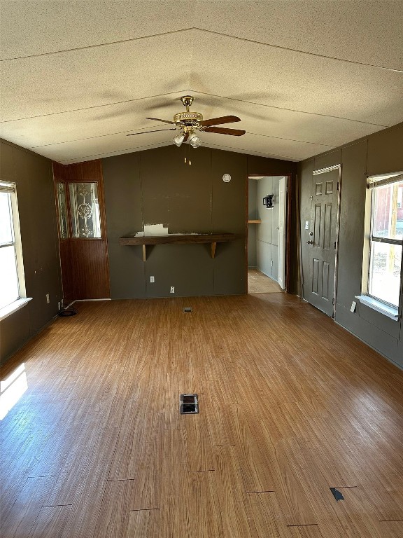 156 Bullfrog Holler Road Dale, TX 78616 - Photo 2 of 10 wooden floor in an empty room with a window