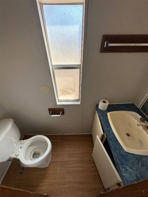 156 Bullfrog Holler Road Dale, TX 78616 - Photo 5 of 10 a bathroom with a toilet sink and mirror