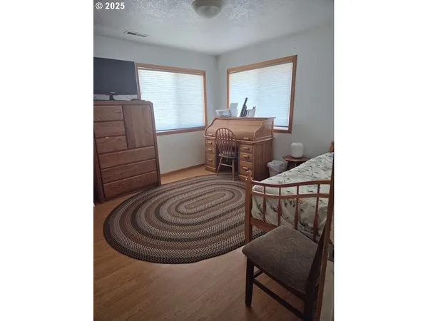 a view of a livingroom with furniture and a ceiling fan