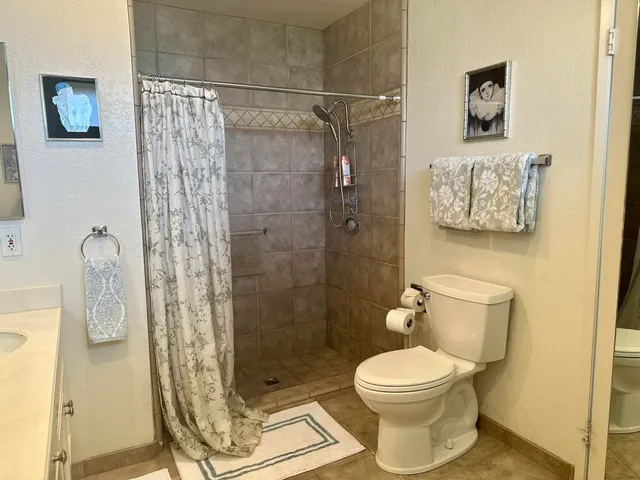 a bedroom with bed and a window