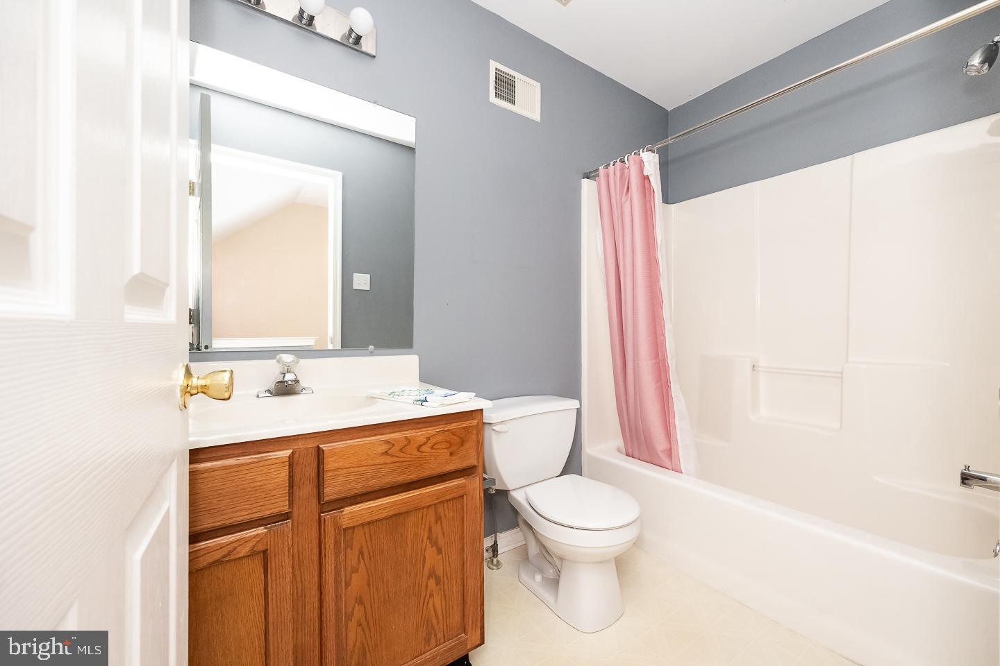 350 Andrew Road Coatesville, PA 19320 - Photo 16 of 20 a bathroom with a sink a toilet and a mirror
