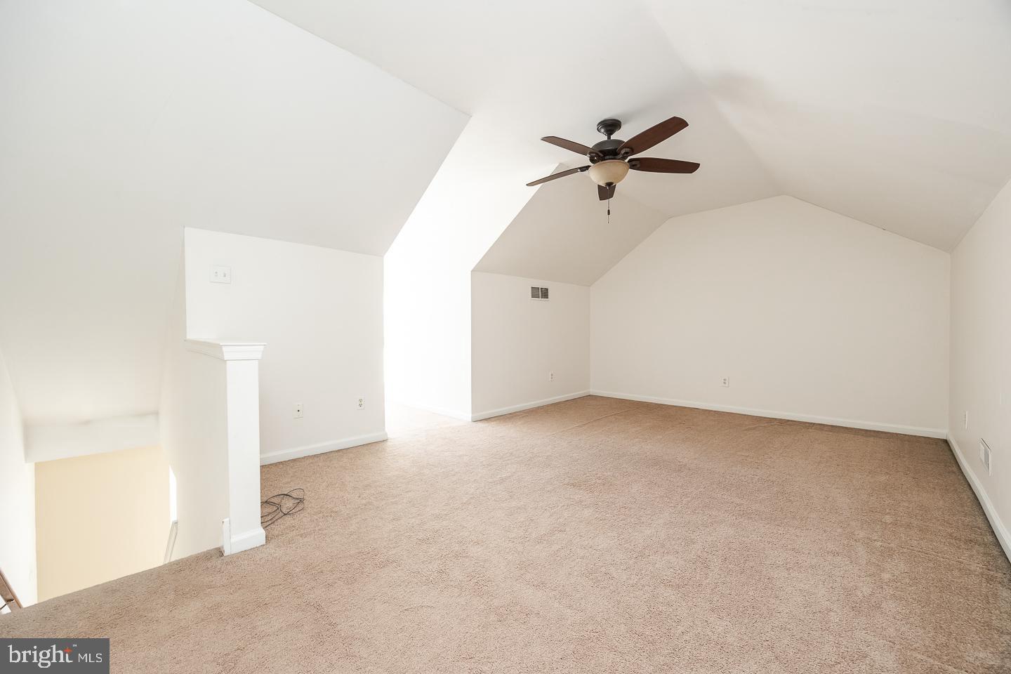 350 Andrew Road Coatesville, PA 19320 - Photo 19 of 20 an empty room with a ceiling fan and a window