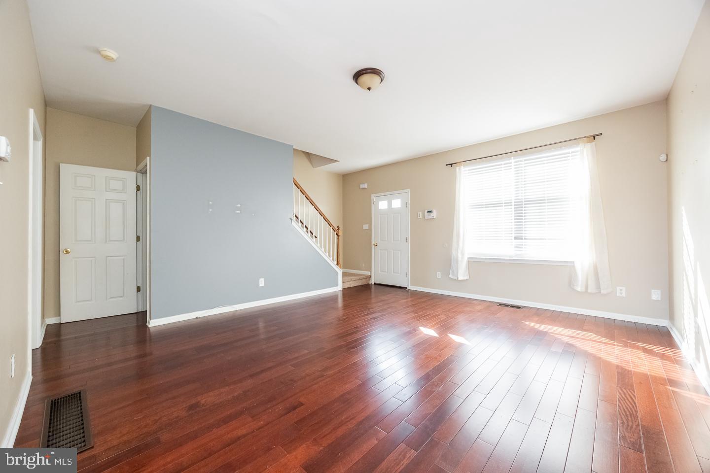 350 Andrew Road Coatesville, PA 19320 - Photo 4 of 20 a view of an empty room with wooden floor and a window