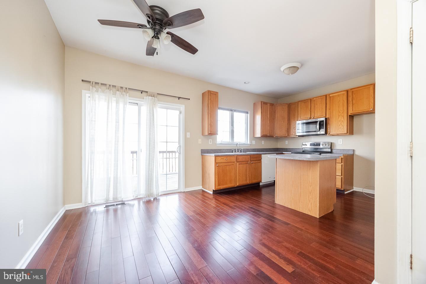 350 Andrew Road Coatesville, PA 19320 - Photo 6 of 20 a kitchen with stainless steel appliances granite countertop a refrigerator a sink dishwasher a stove and white countertops with wooden floor