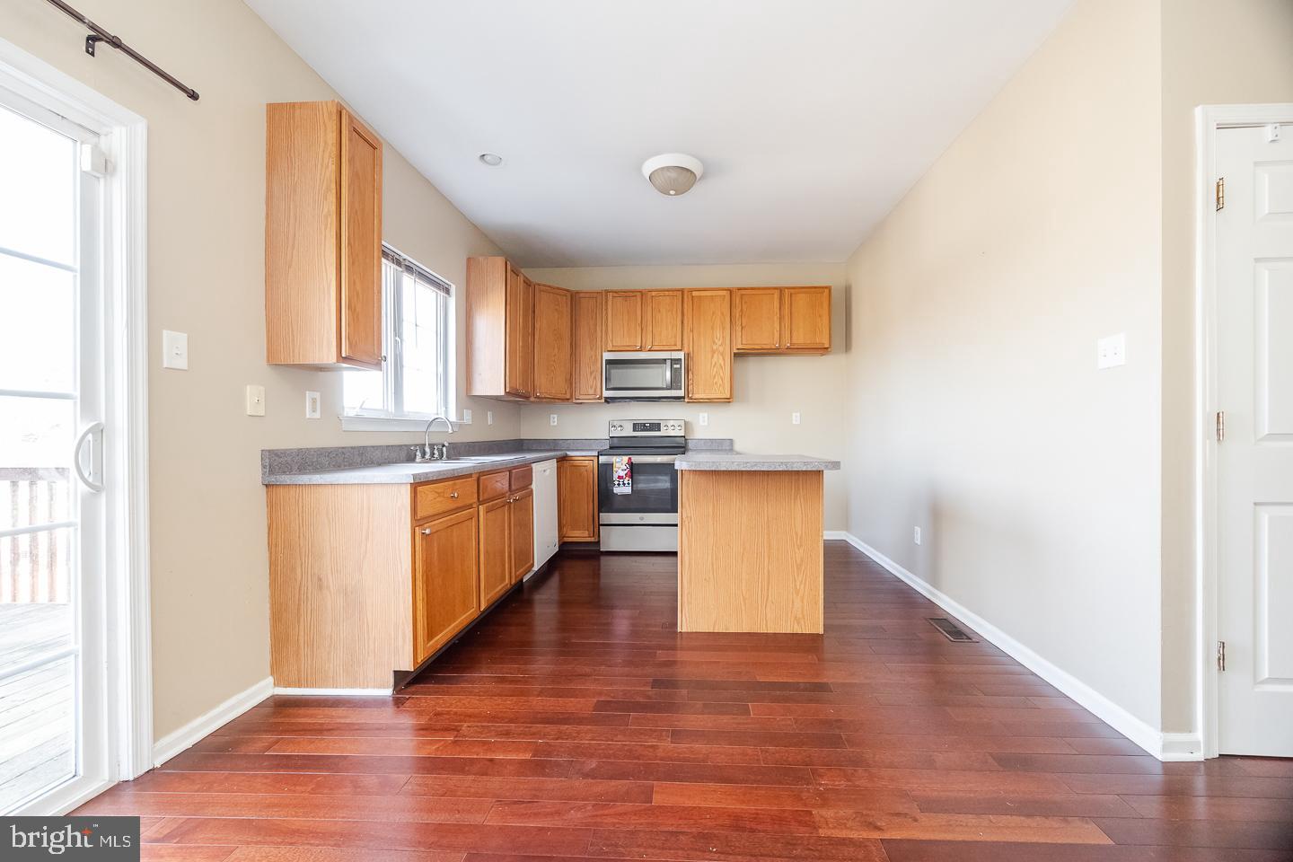 350 Andrew Road Coatesville, PA 19320 - Photo 7 of 20 a kitchen with stainless steel appliances granite countertop a stove top oven a sink and a microwave