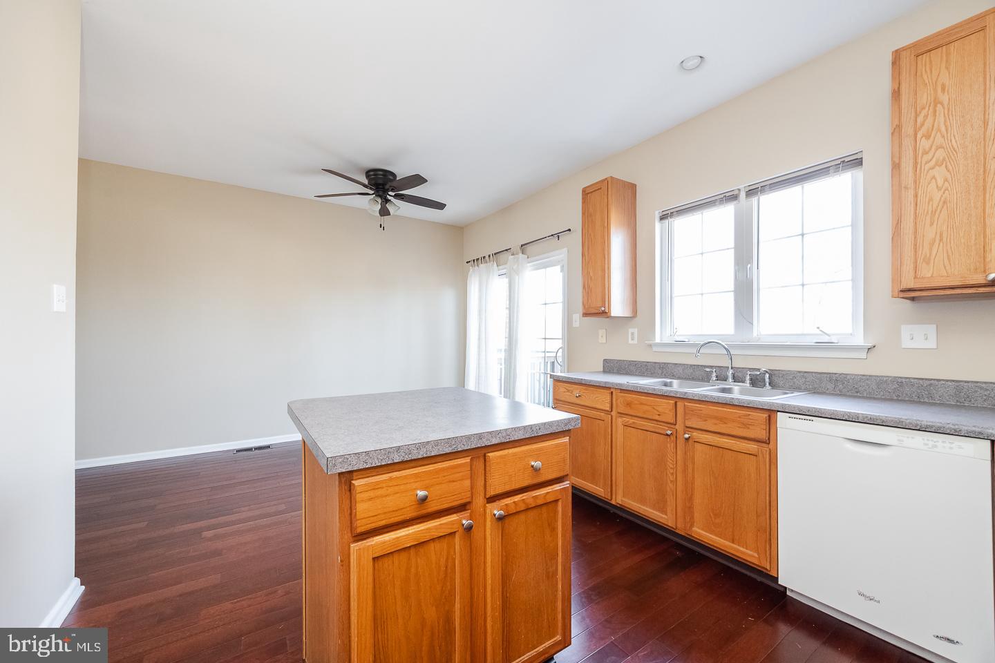 350 Andrew Road Coatesville, PA 19320 - Photo 8 of 20 a kitchen with stainless steel appliances granite countertop a sink cabinets and wooden floor