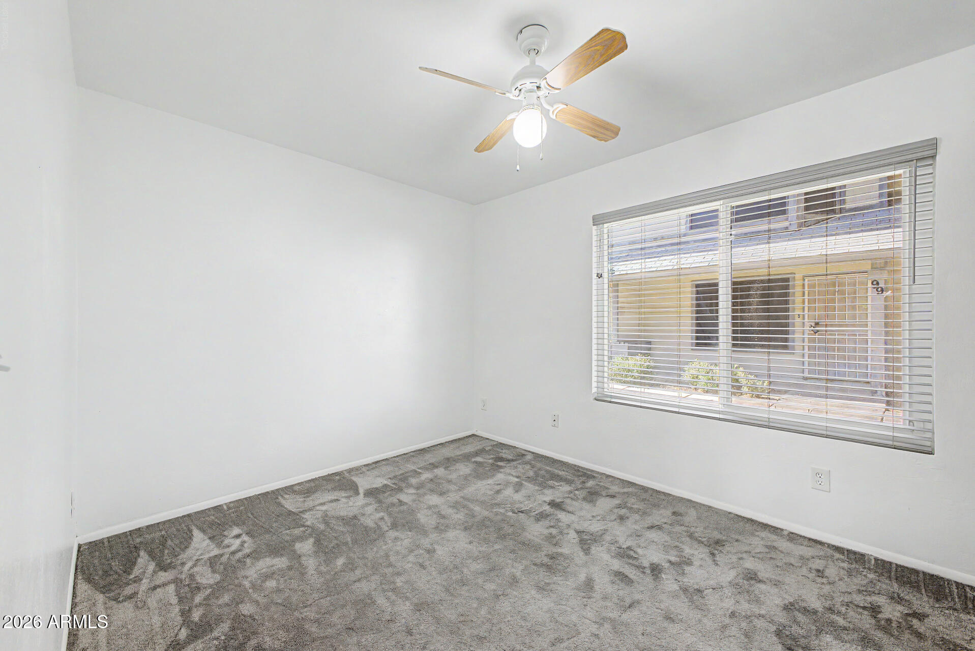 2455 East Broadway Road, Unit 103 Mesa, AZ 85204 - Photo 15 of 22 a view of an empty room with a window