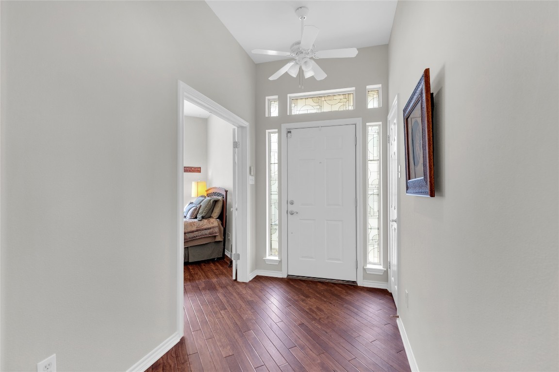 2918 Ranch Road 620 North, Unit L173 Austin, TX 78734 - Photo 12 of 35 Entryway featuring baseboards, dark wood-type flooring, and ceiling fan
