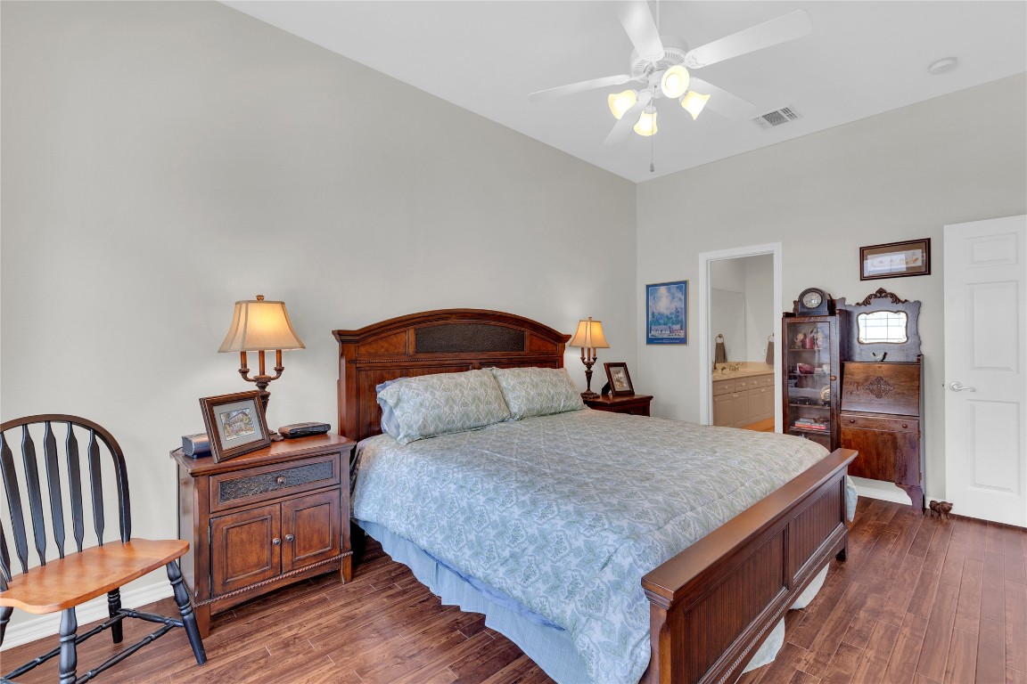 2918 Ranch Road 620 North, Unit L173 Austin, TX 78734 - Photo 14 of 35 Bedroom with dark wood finished floors and ceiling fan
