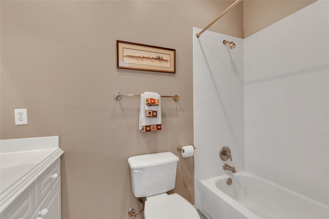 2918 Ranch Road 620 North, Unit L173 Austin, TX 78734 - Photo 19 of 35 Bathroom with toilet, vanity, and bathtub / shower combination