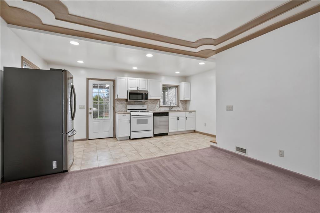 927 Greenhill Road Pittsburgh, PA 15209 - Photo 11 of 41 a view of a kitchen with a refrigerator a stove top oven