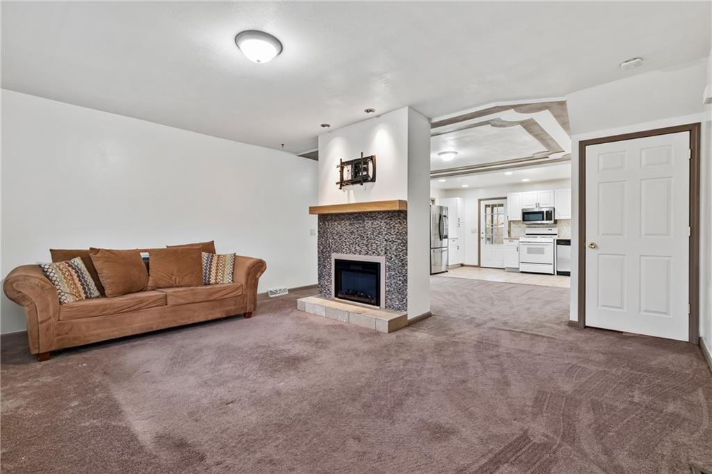 927 Greenhill Road Pittsburgh, PA 15209 - Photo 2 of 41 a living room with furniture and a fireplace