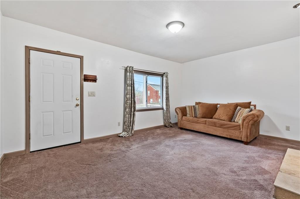 927 Greenhill Road Pittsburgh, PA 15209 - Photo 7 of 41 a living room with furniture and a window