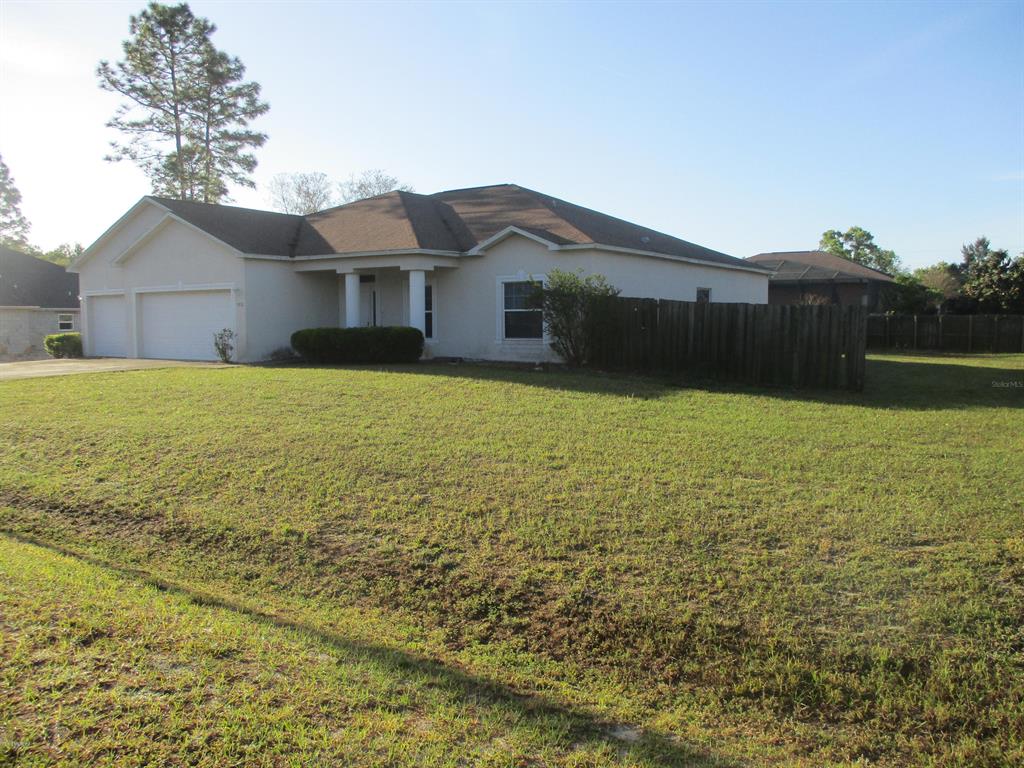 4892 Southwest 112th Street Ocala, FL 34476 - Photo 1 of 1 a house view with a outdoor space