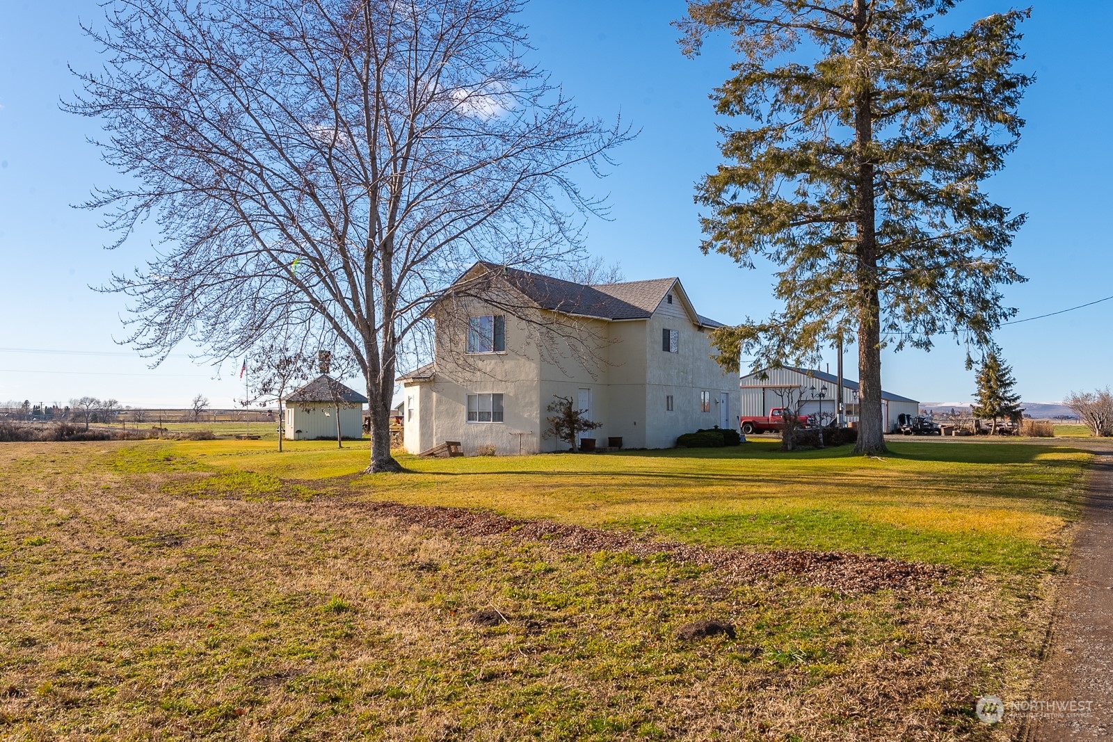 20226 Adrian Road Northeast Soap Lake, WA 98851 - Photo 32 of 35 a view of a house with a yard and swimming pool