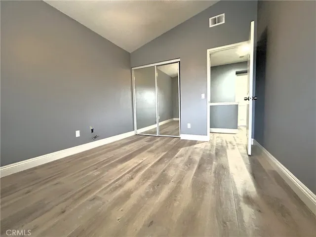 a view of a livingroom with wooden floor