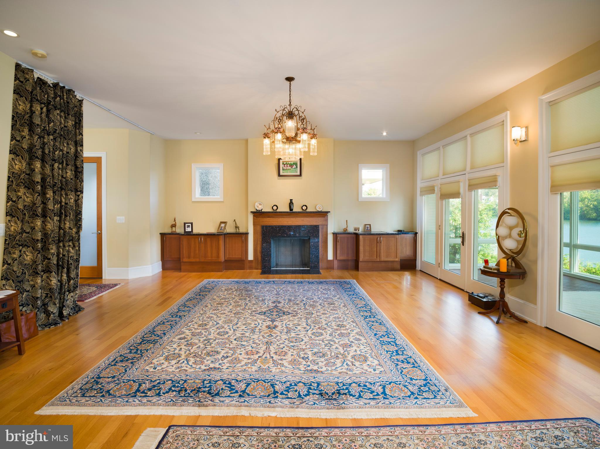 236 River Road Gladwyne, PA 19035 - Photo 12 of 50 a living room with fireplace furniture and a wooden floor