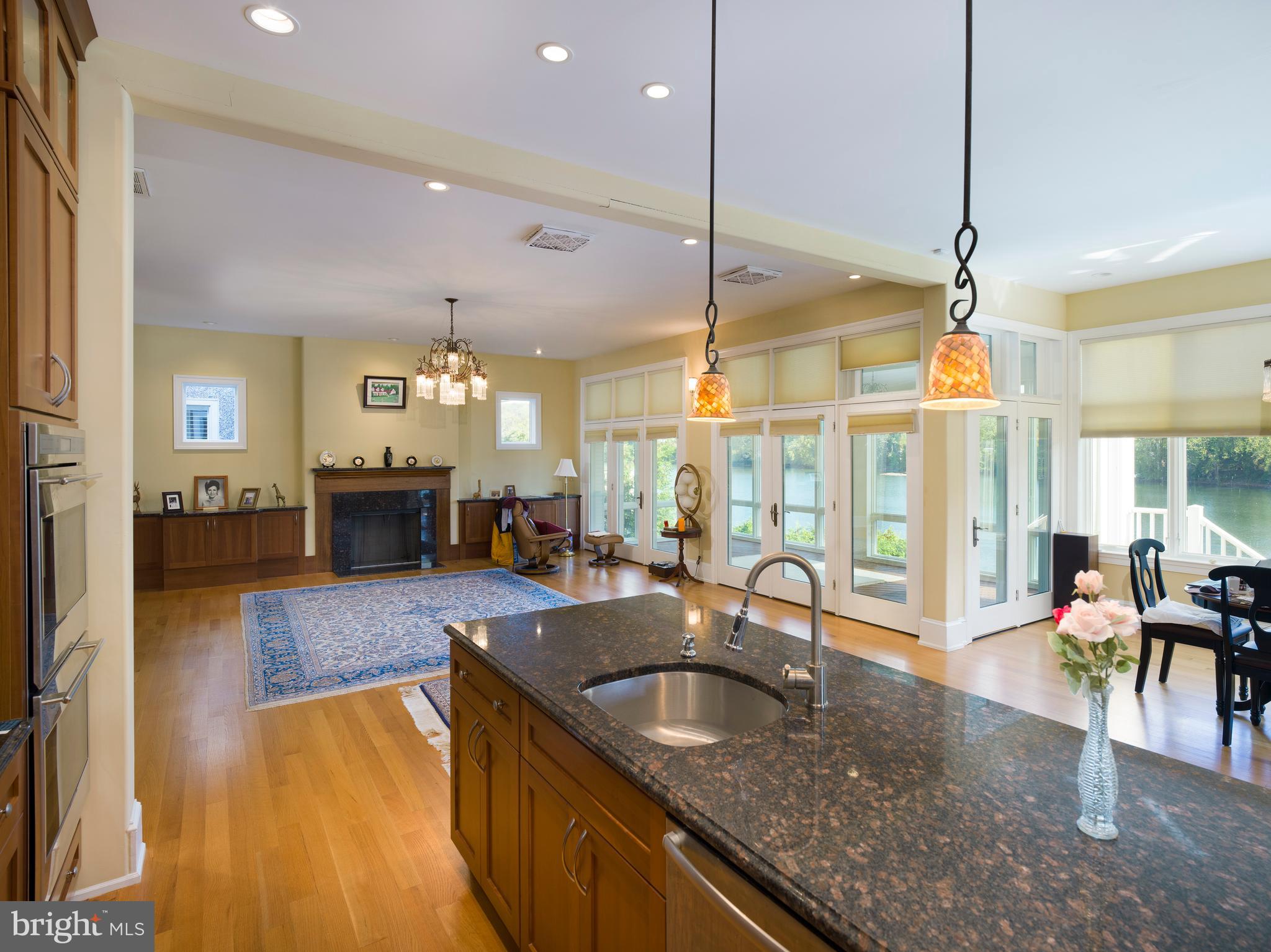 236 River Road Gladwyne, PA 19035 - Photo 15 of 50 a kitchen with granite countertop a sink counter top space and living room view