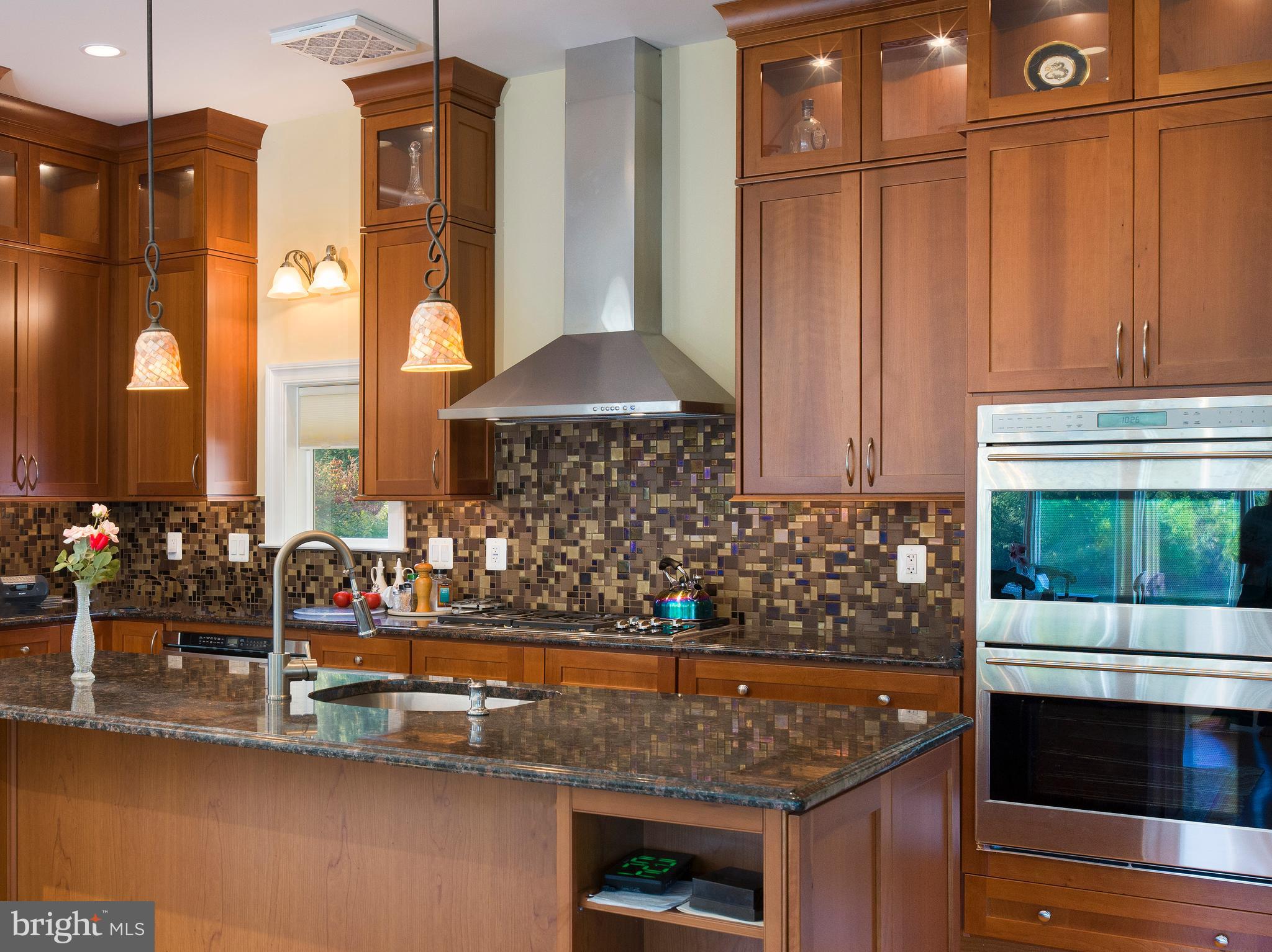 236 River Road Gladwyne, PA 19035 - Photo 17 of 50 a kitchen with stainless steel appliances granite countertop a stove and a sink