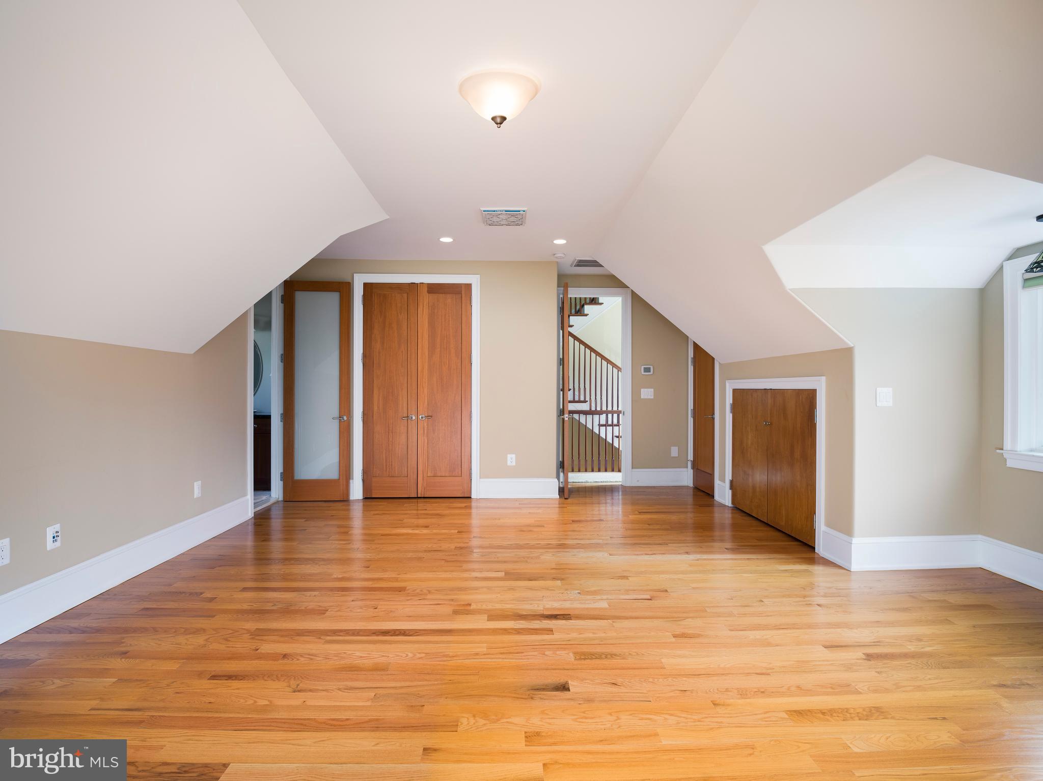 236 River Road Gladwyne, PA 19035 - Photo 24 of 50 a view of an empty room with window and wooden floor