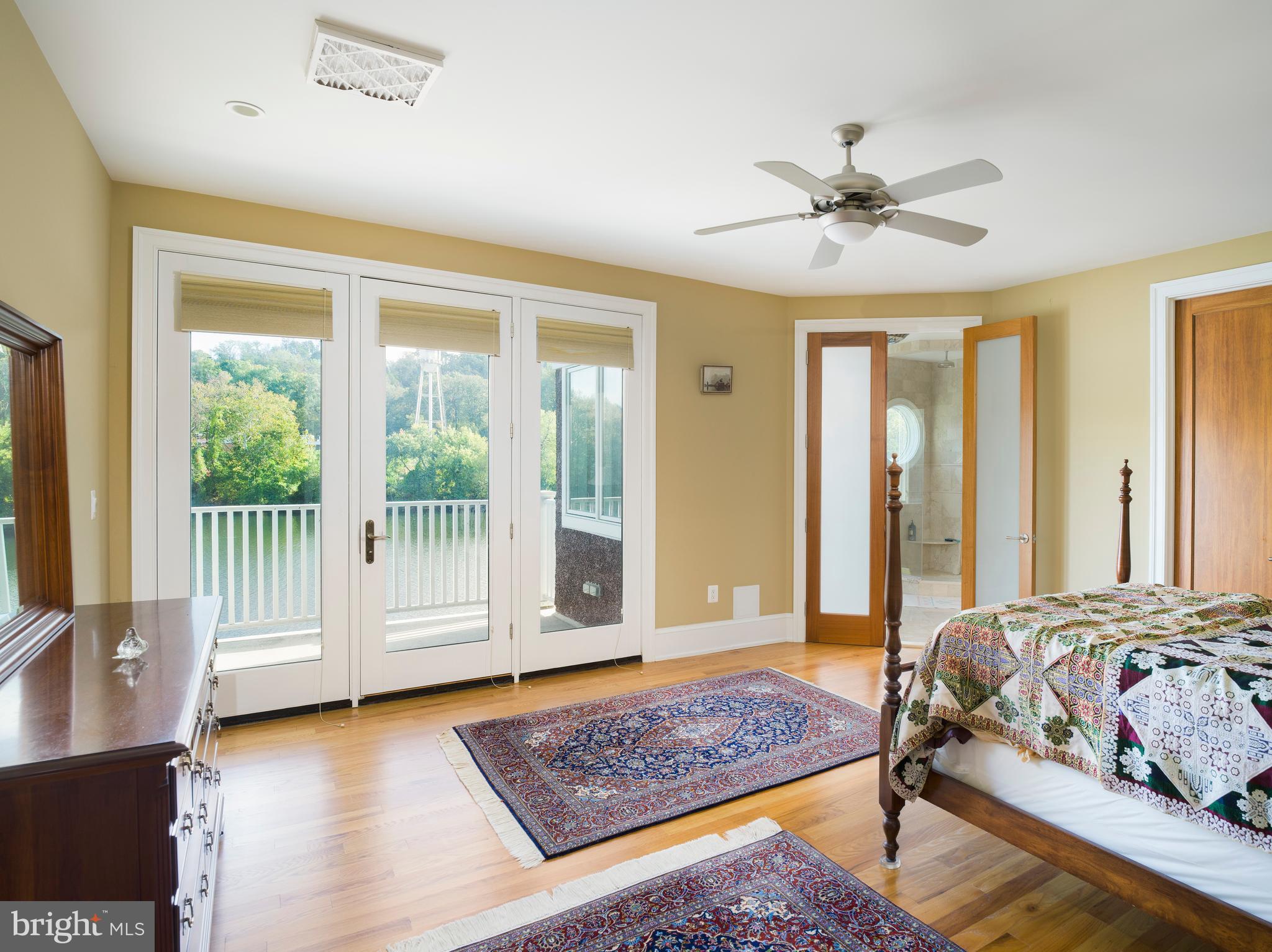 236 River Road Gladwyne, PA 19035 - Photo 31 of 50 a bedroom with a bed and glass window