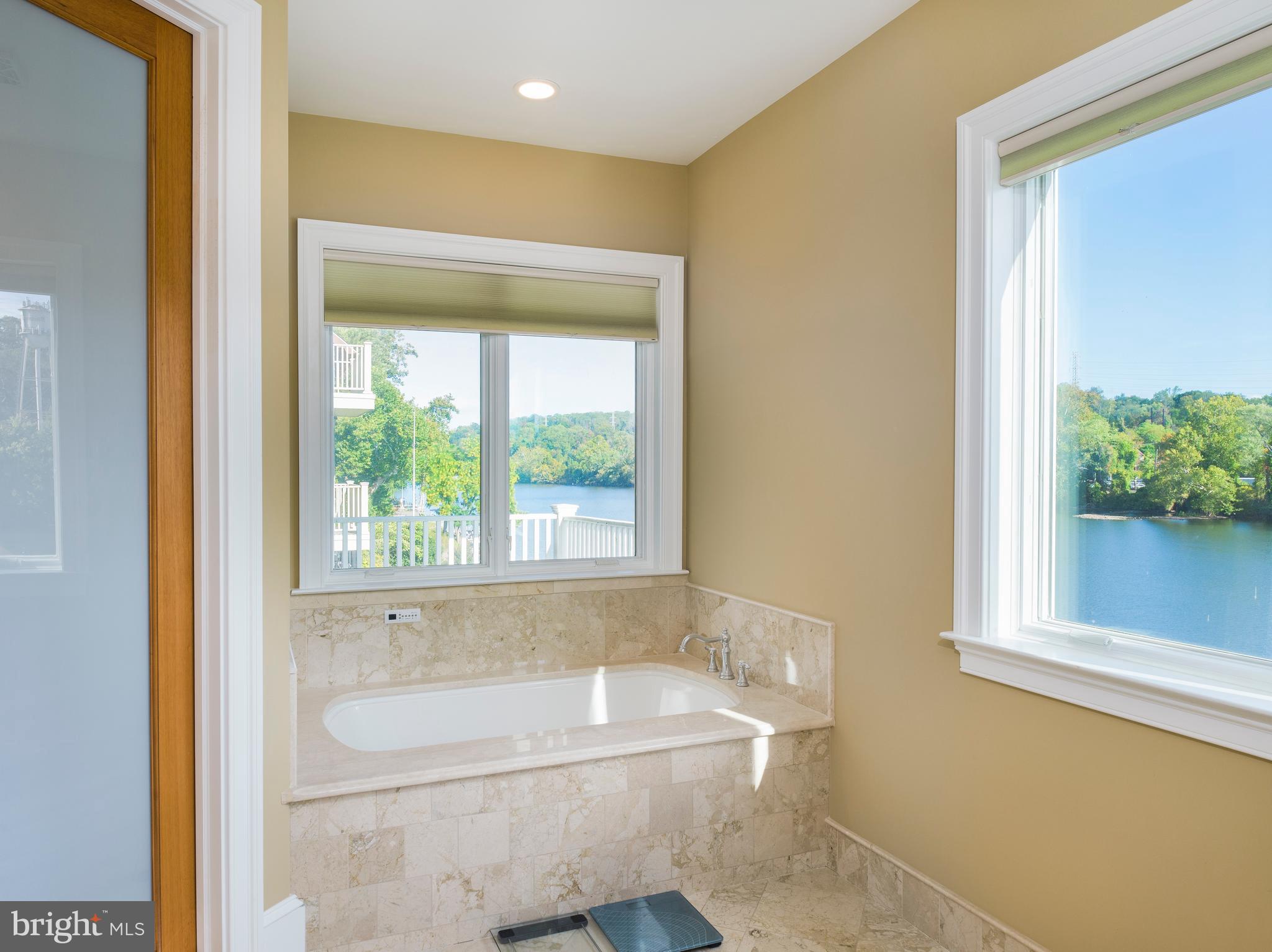 236 River Road Gladwyne, PA 19035 - Photo 35 of 50 a bathroom with a bathtub and a window