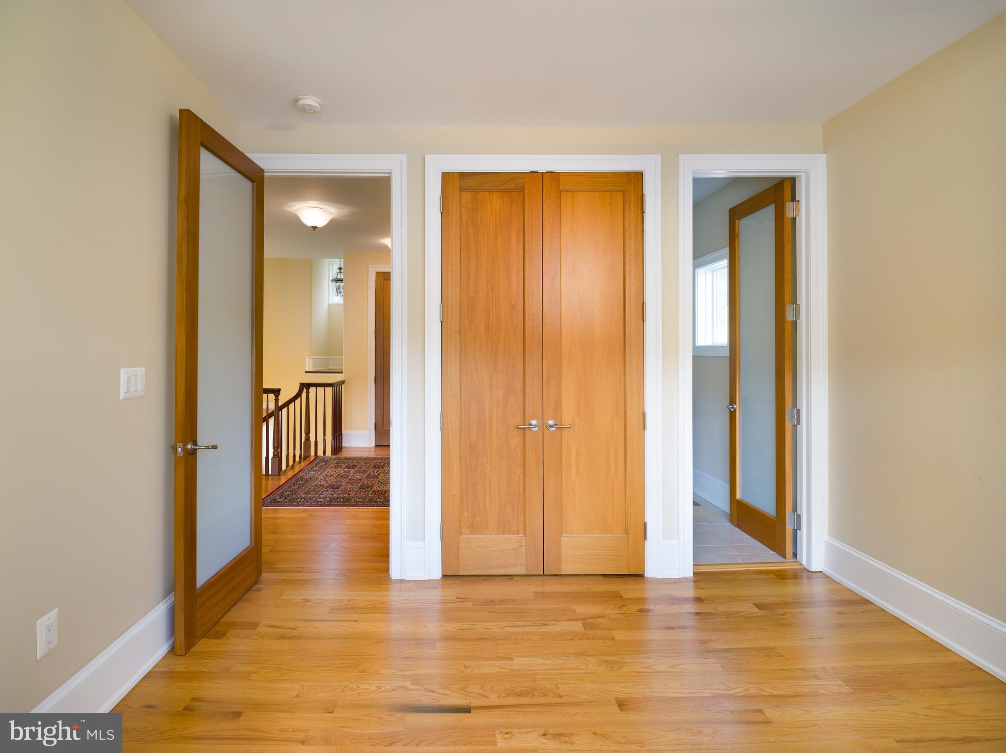 236 River Road Gladwyne, PA 19035 - Photo 37 of 50 a view of a hallway with wooden floor and furniture