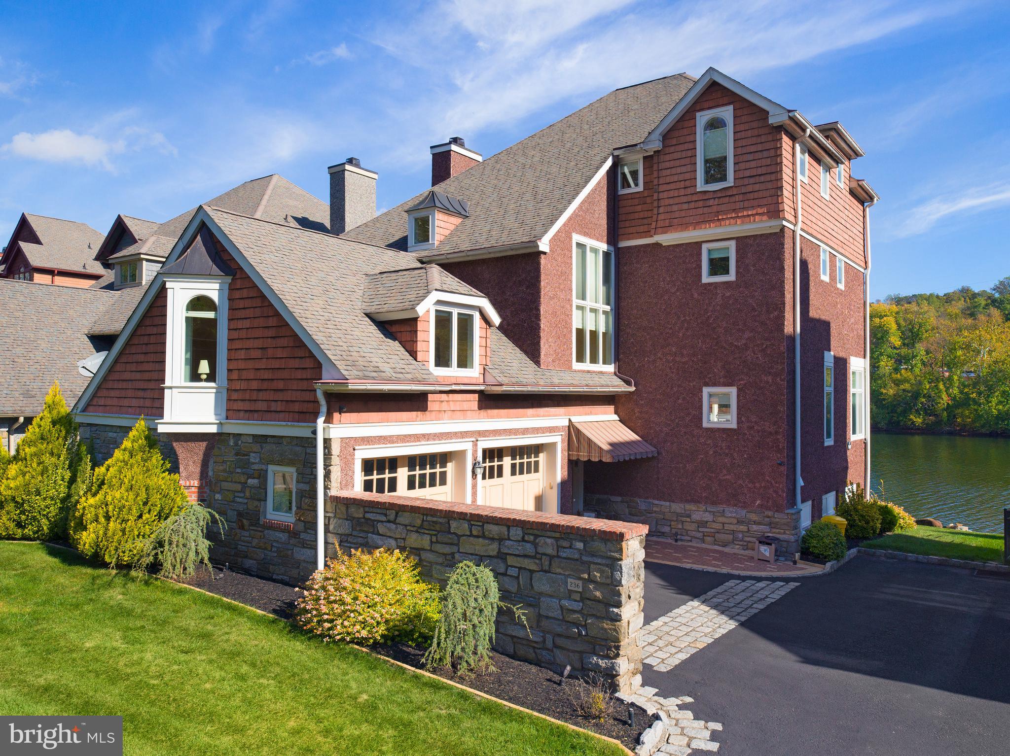 236 River Road Gladwyne, PA 19035 - Photo 4 of 50 a front view of a house with a yard