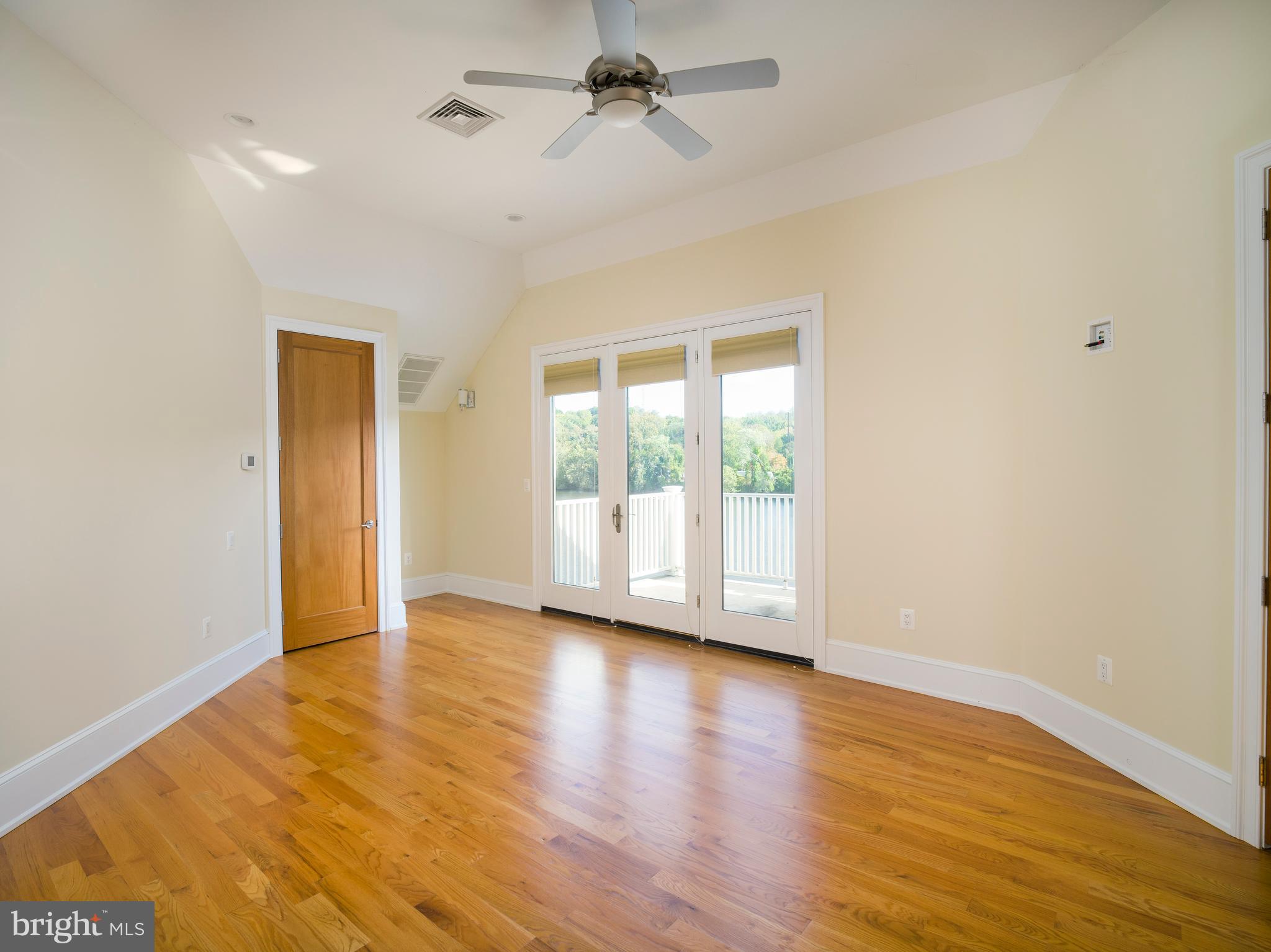 236 River Road Gladwyne, PA 19035 - Photo 41 of 50 an empty room with wooden floor and windows
