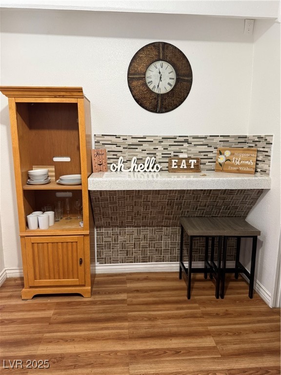 5171 Reeder Circle, Unit C Las Vegas, NV 89119 - Photo 9 of 17 Detailed view of tasteful backsplash and wood finished floors
