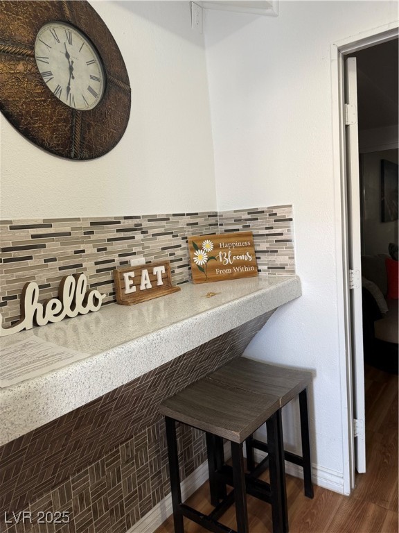 5171 Reeder Circle, Unit C Las Vegas, NV 89119 - Photo 10 of 17 Detailed view of wood finished floors and decorative backsplash