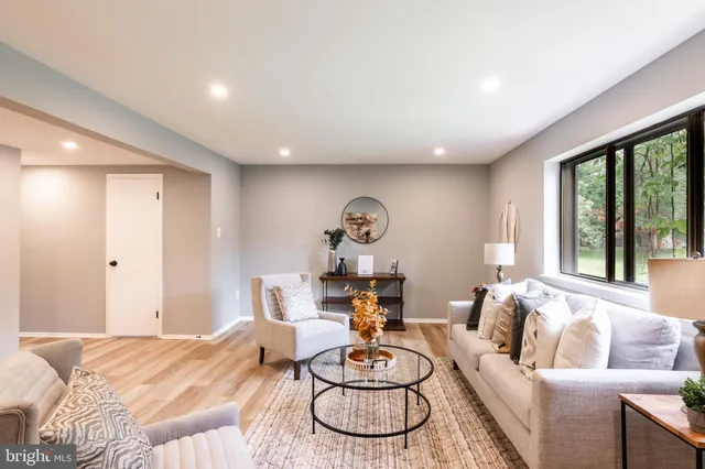 a living room with furniture and a table