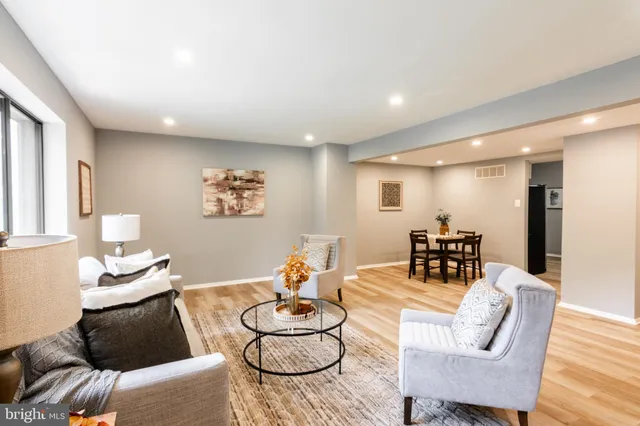 a living room with furniture and a table