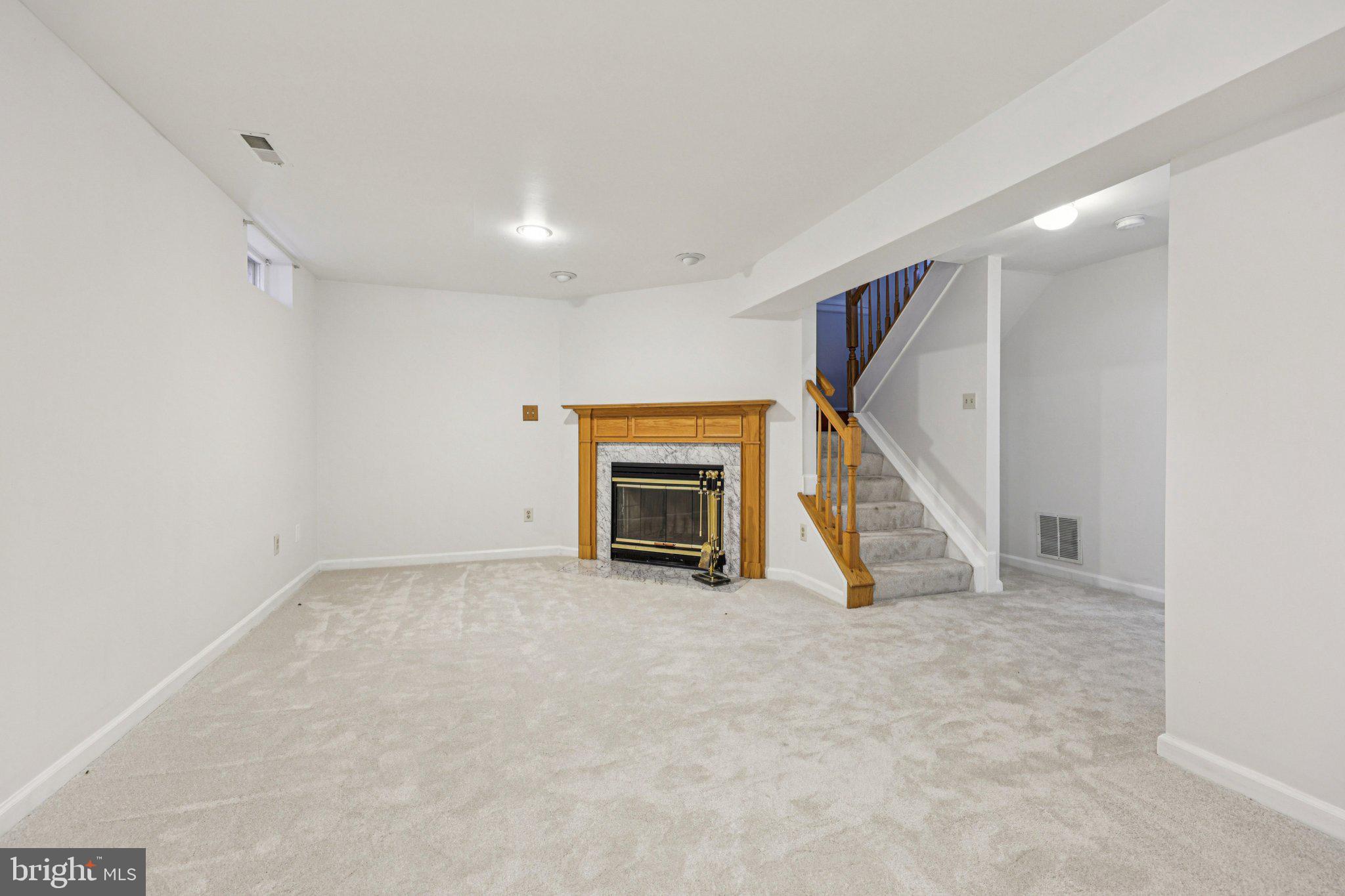 43494 Postrail Square Ashburn, VA 20147 - Photo 12 of 38 a view of an empty room with a fireplace