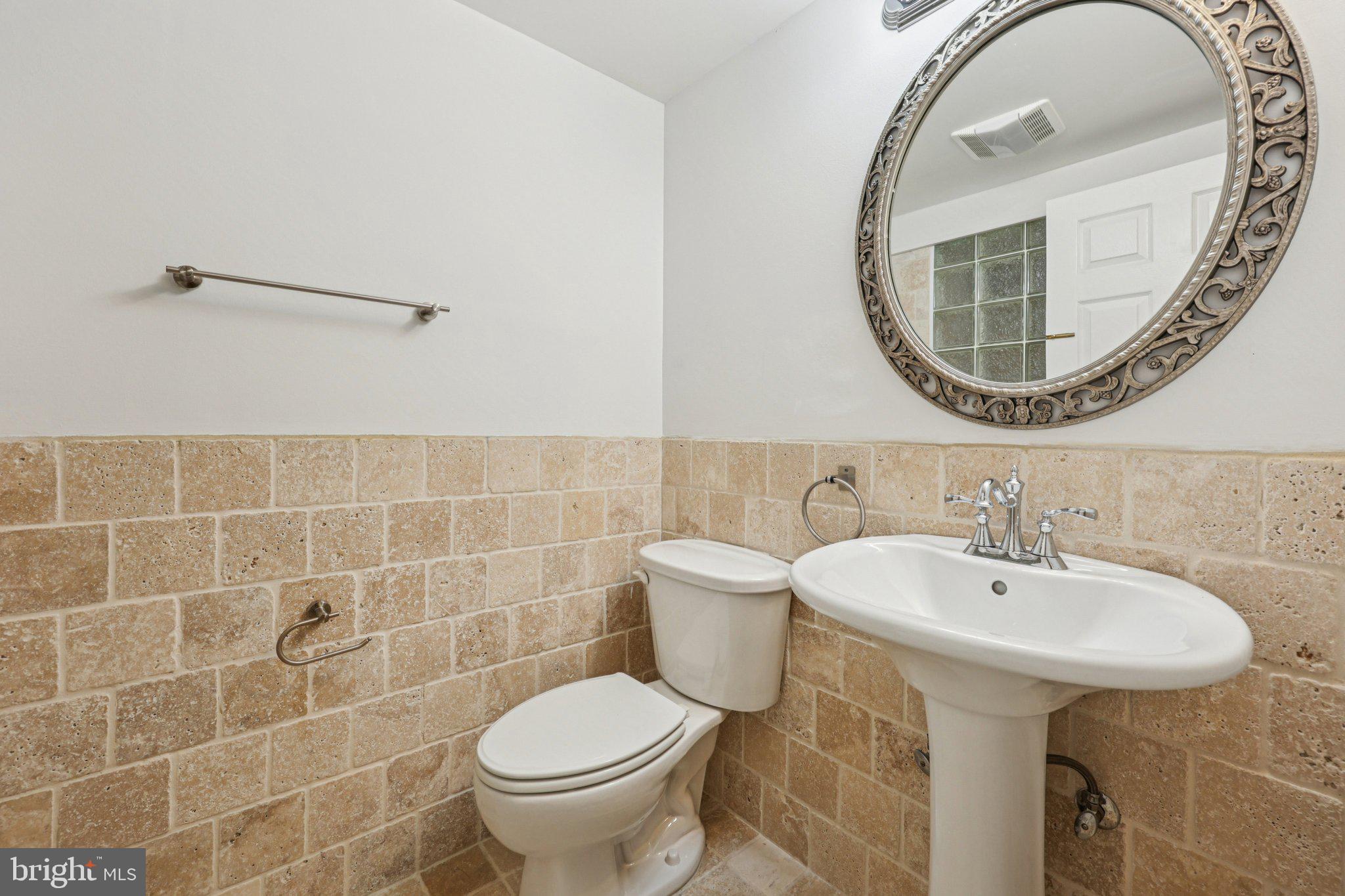 43494 Postrail Square Ashburn, VA 20147 - Photo 18 of 38 a bathroom with a sink and a mirror
