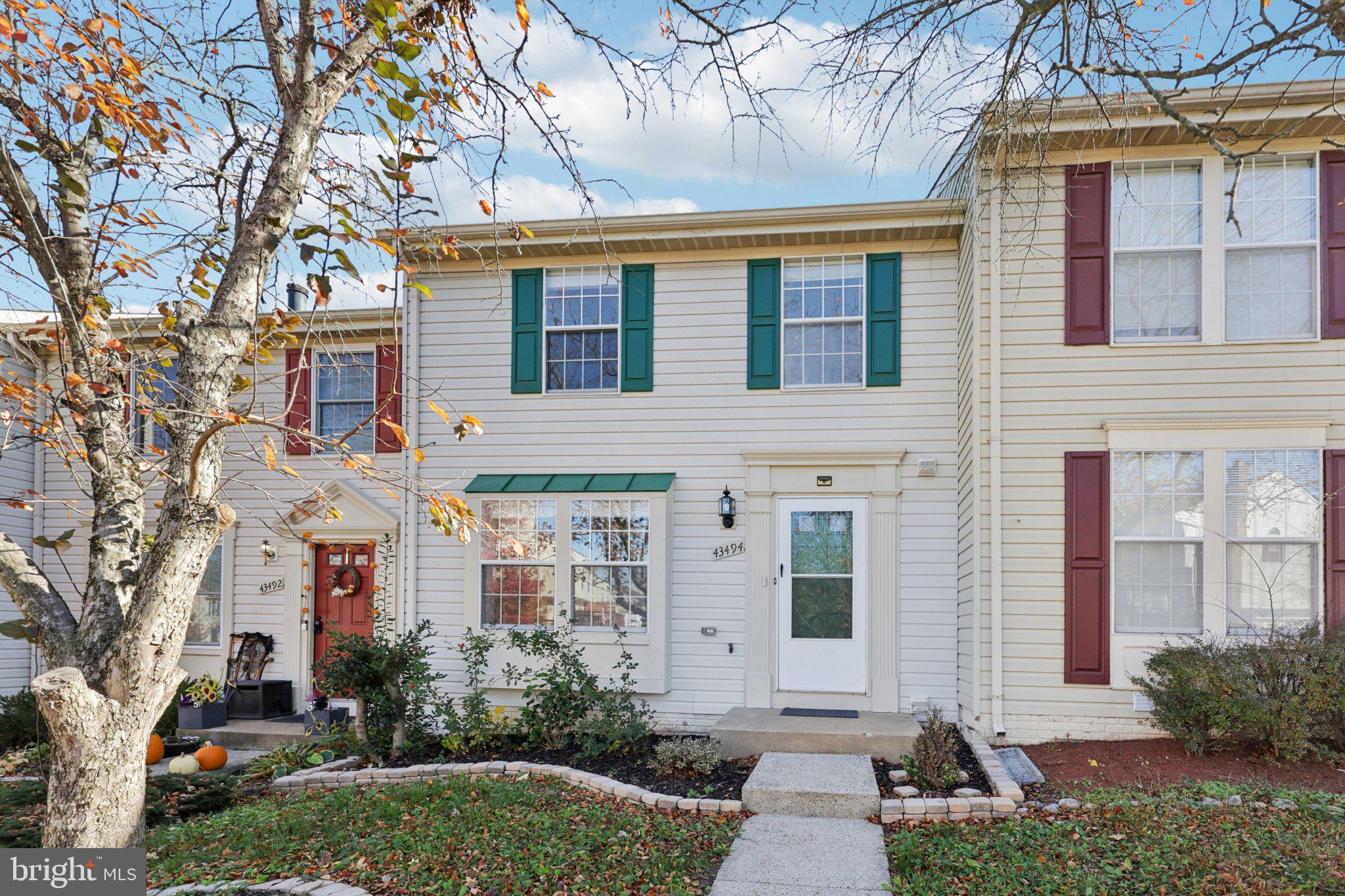 43494 Postrail Square Ashburn, VA 20147 - Photo 2 of 38 a front view of a house with garden