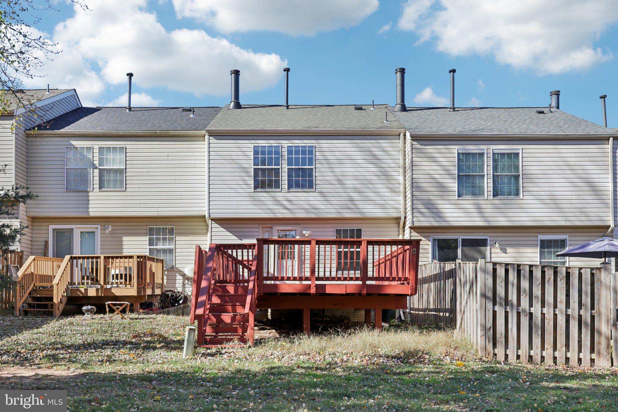 43494 Postrail Square Ashburn, VA 20147 - Photo 35 of 38 a front view of a house with a yard