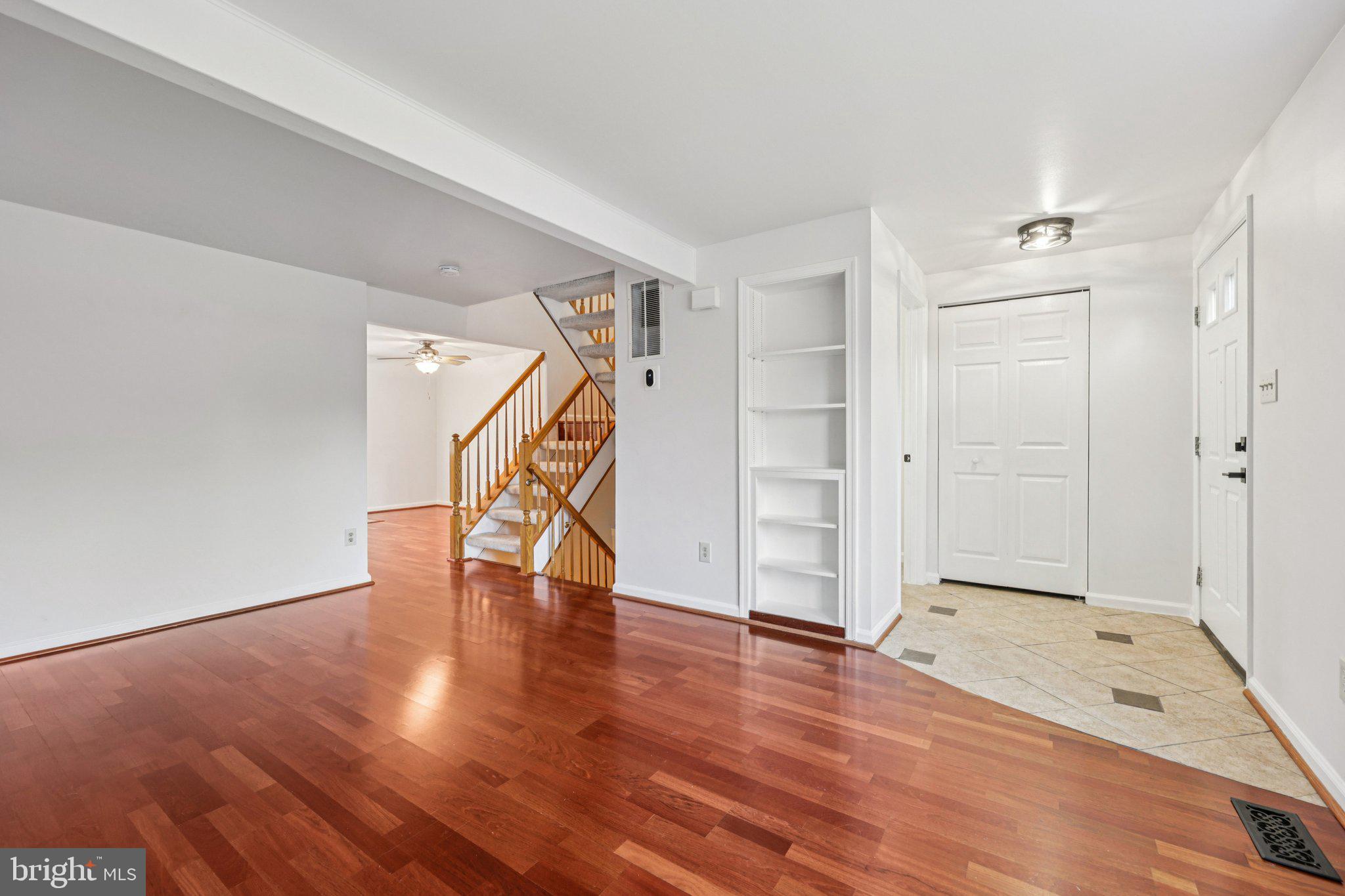 43494 Postrail Square Ashburn, VA 20147 - Photo 7 of 38 a view of an empty room with wooden floor and a window