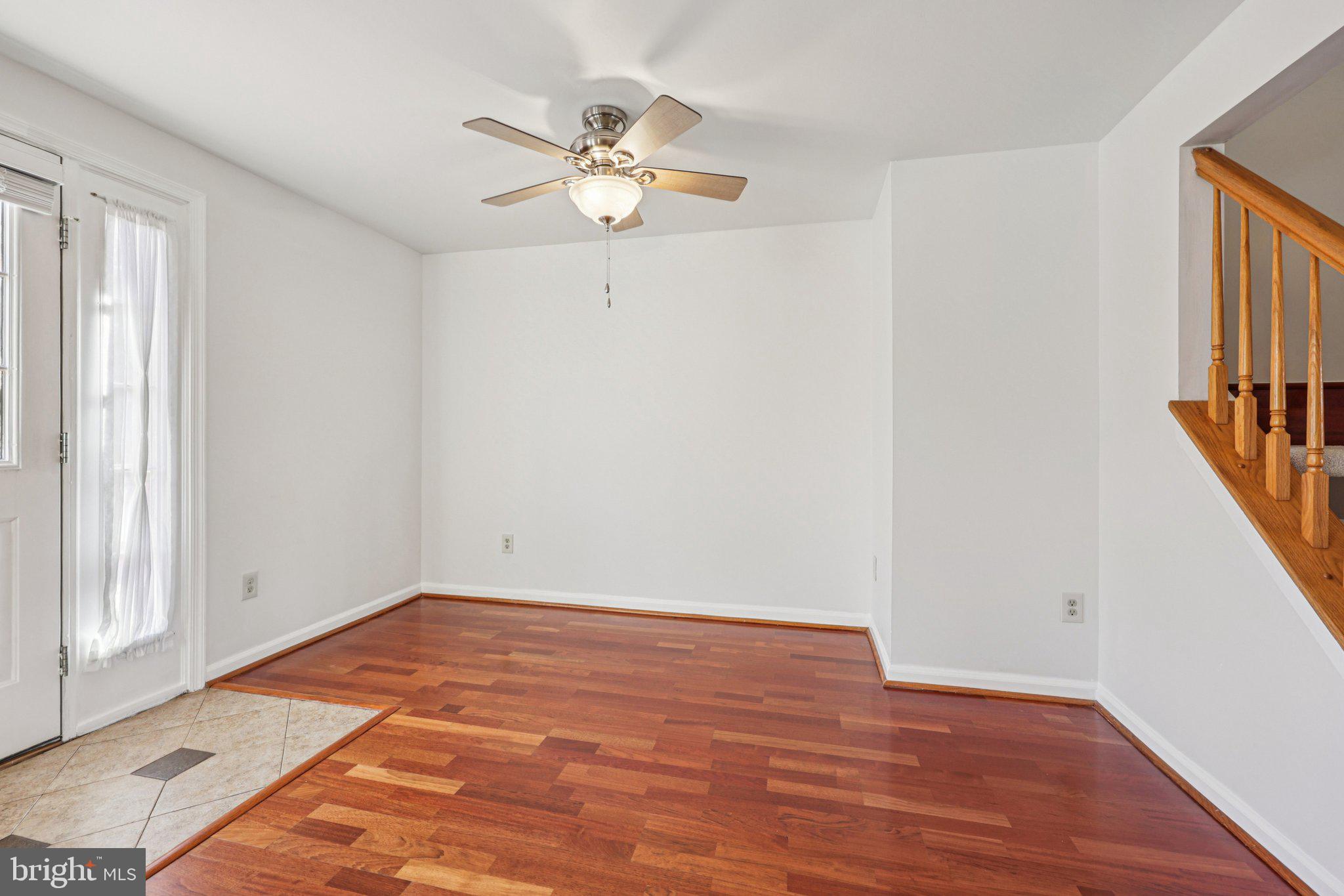 43494 Postrail Square Ashburn, VA 20147 - Photo 10 of 38 wooden floor in an empty room with a window