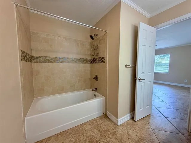 a bathroom with a bathtub and a sink