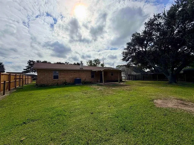 a backyard of a house with lots of green space