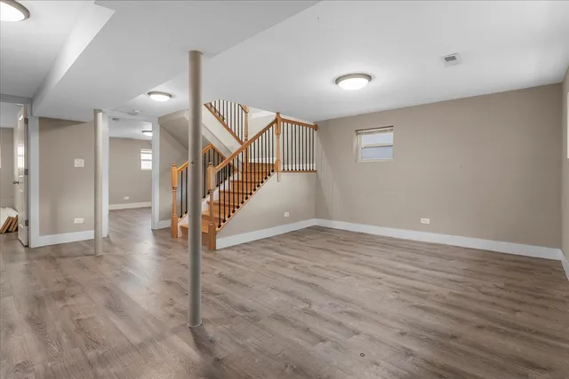 a view of an entryway with wooden floor