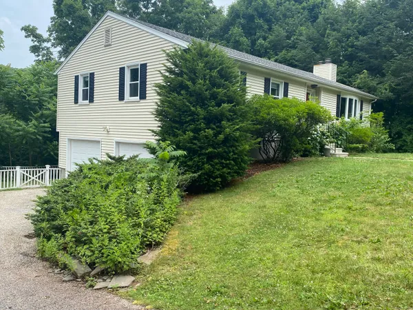 a view of a backyard of the house