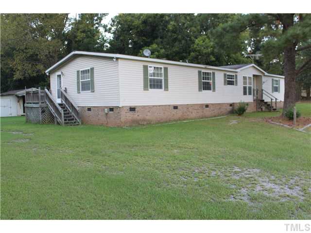 1553 Lettuce Hall Road Spring Hope, NC 27882 - Photo 14 of 16 a view of a house with a yard and sitting area