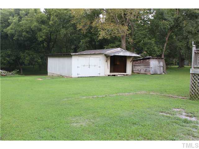 1553 Lettuce Hall Road Spring Hope, NC 27882 - Photo 15 of 16 a view of a tiny house with a yard